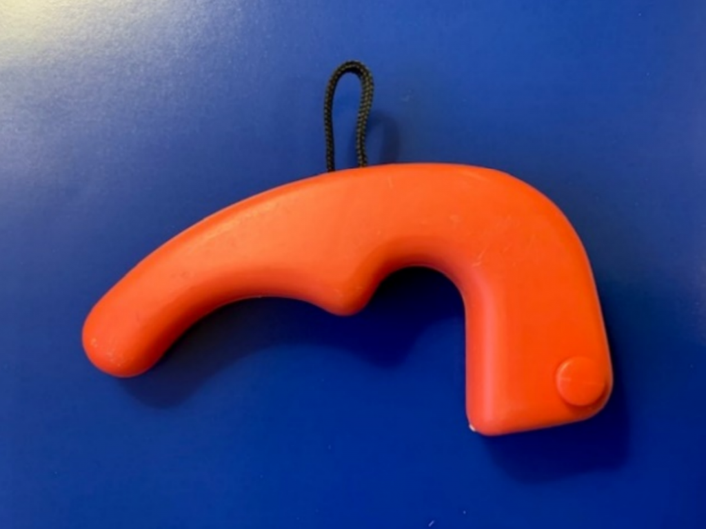 closeup of an orange plastic henger eze