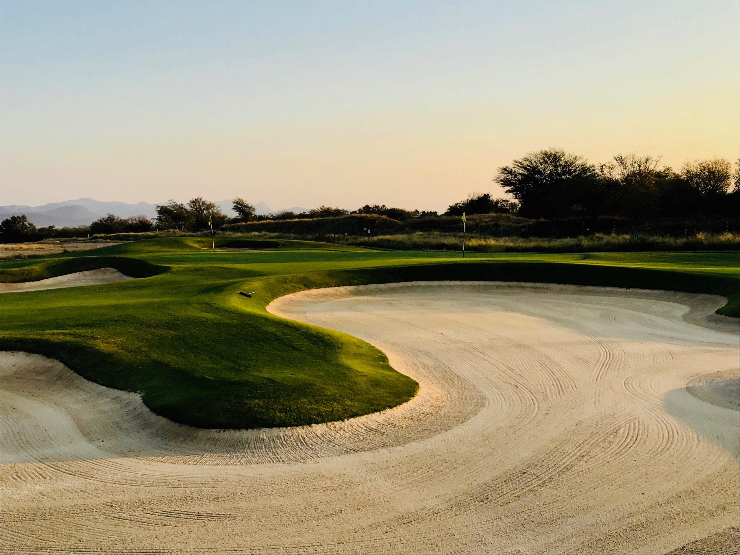 Golf Course at Sunset, the greens near a sand bunker